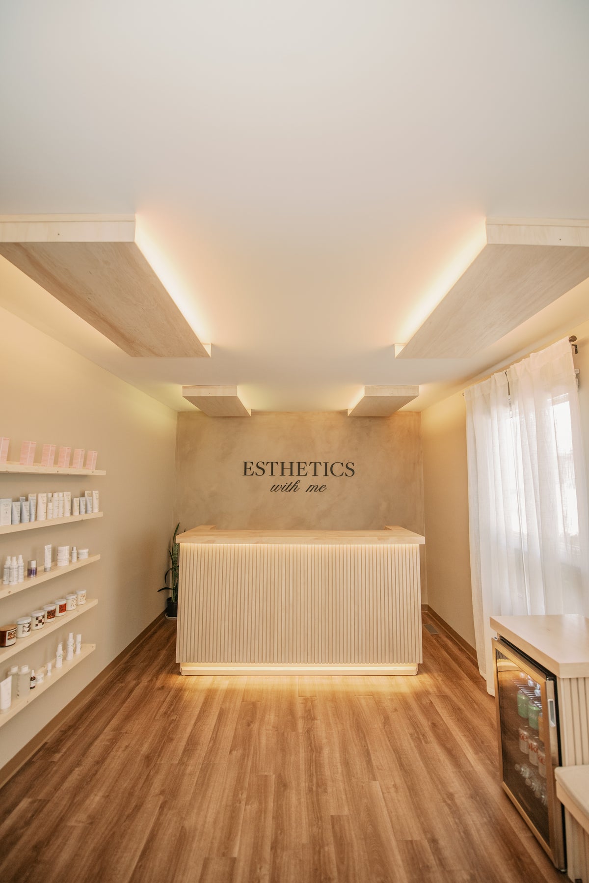 Front entry and reception desk of the Esthetics With Me studio in McHenry, IL